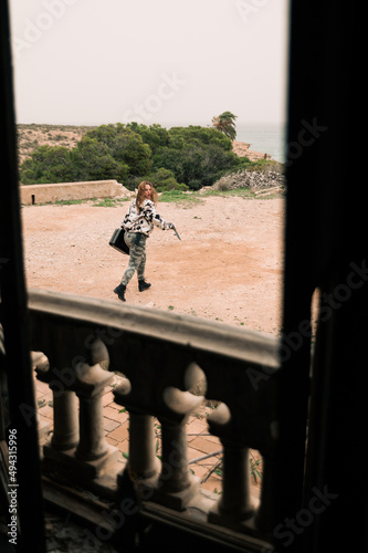 woman running away with jerrycan photo