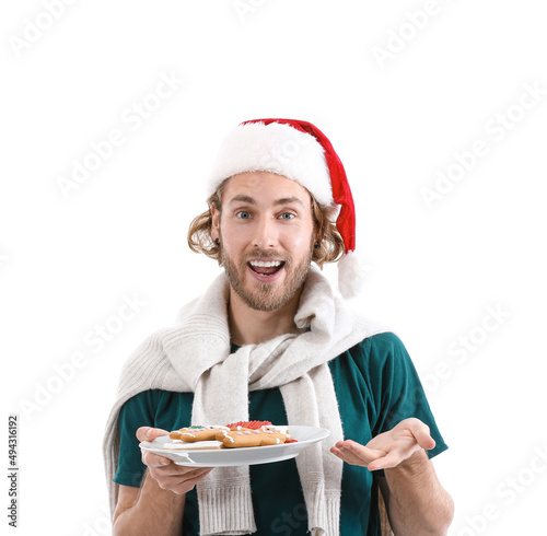 Young man in Santa hat hold...