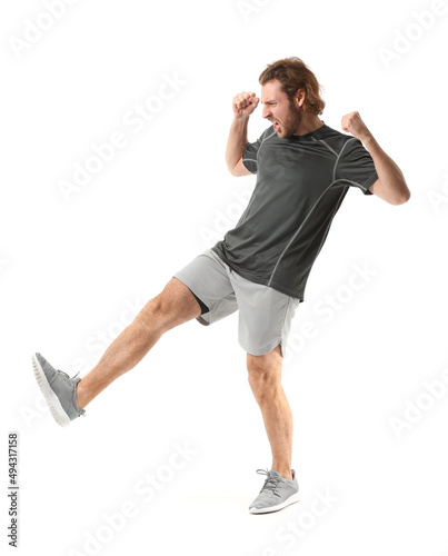 Sporty male kickboxer on wh...