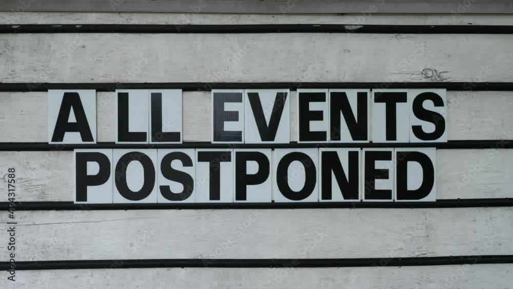 All Events Postponed sign in small community during Covid 19 Coronavirus pandemic. All Events Postponed sign in small community during Covid 19 Coronavirus pandemic.