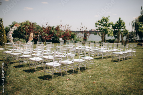 wedding ceremony preparation, transparent chiavari chairs 