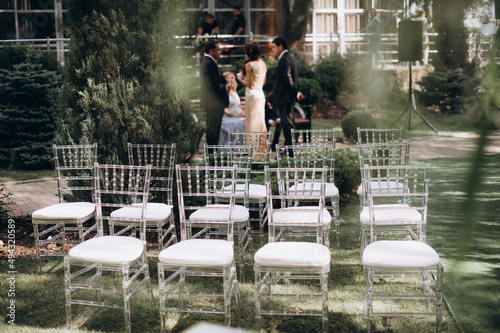 wedding ceremony preparation, transparent chiavari chairs 