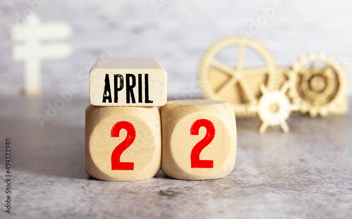 April 22nd. Earth Day. Image of april 22 wooden color calendar on white background. photo