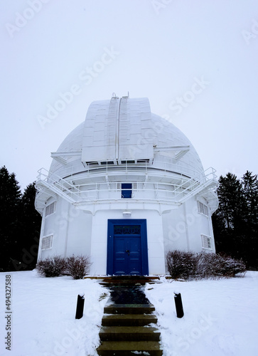 Vertical shot of the Richmond Hill David Dunlap Observatory in the winter in Richmond Hill, Canada photo