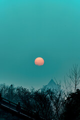 Keuken achterwand Turquoise Volle maan boven kale winterbomen  © Zingy/Wirestock Creators