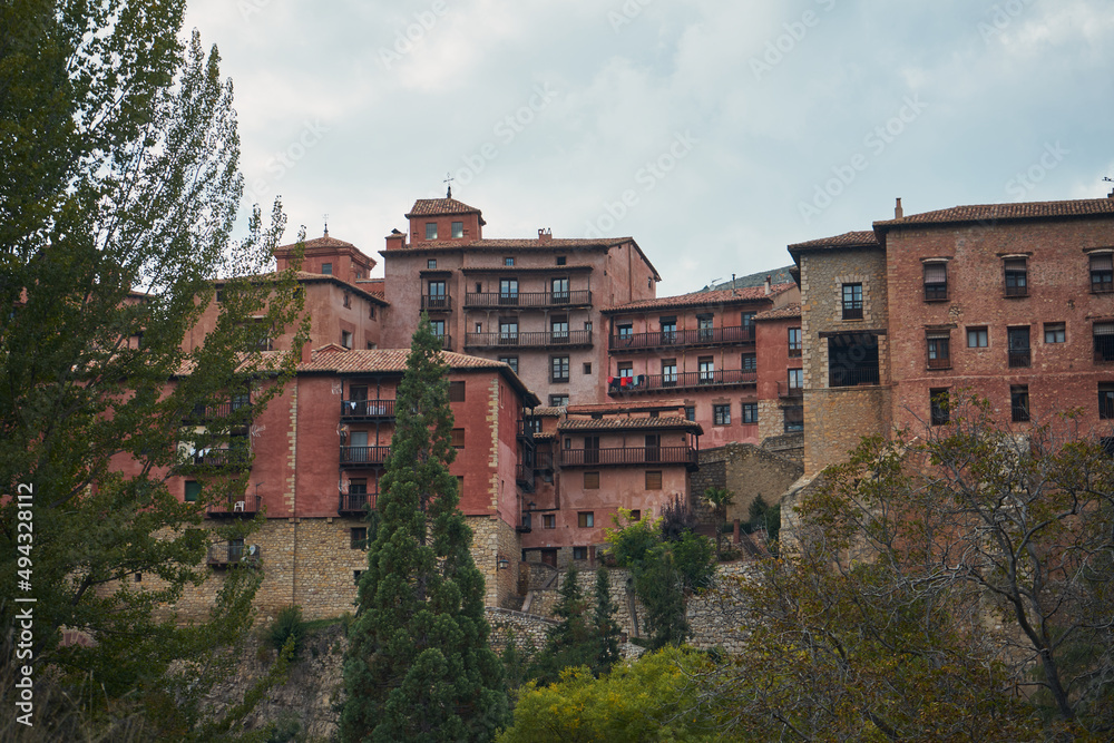 View of the Albarracin, Teruel, Spain, in a summer afetrnoon, red houses in front line.
