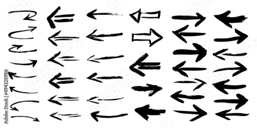 Black grunge arrows isolated on white background. Hand drawn vector illustration.