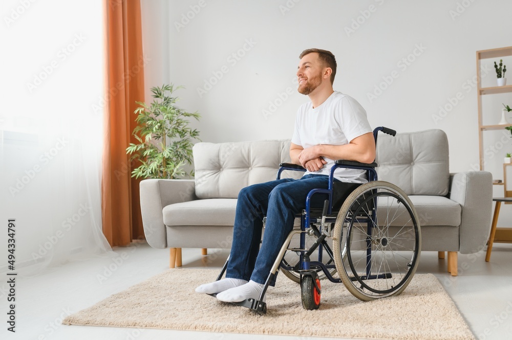 Young handsome man in wheelchair