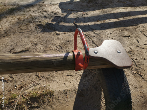 Close-up of a wooden swing balancer for kids