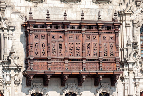 Closeup shot of a window of a historical building in Plaza de Armas, Lima, Peru photo