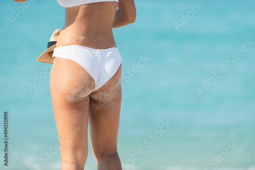 person in bikini. woman in bikini. Girl posing on the beach in bikini