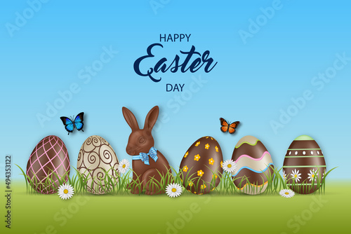 Easter background with chocolate eggs and rabbit