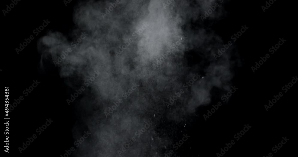 An explosion of dust from the ashes on a black background.