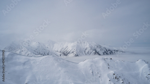 Snow-white mountains in the fog