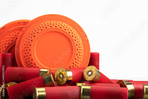 Clay disc flying targets and shotgun bullets on white background ,Clay Pigeon target game