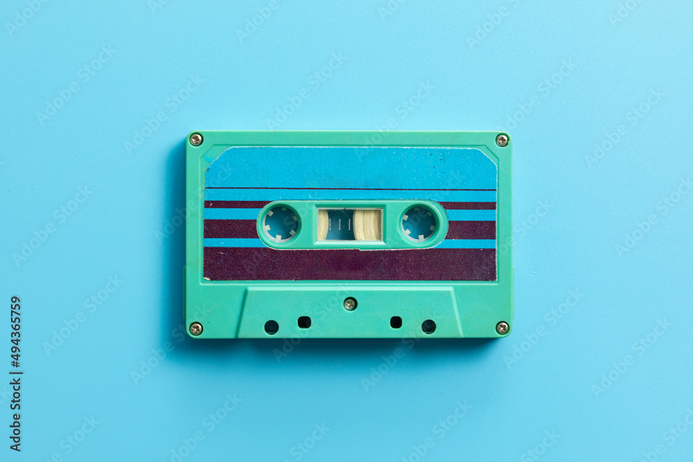 Fototapeta premium Vintage audio cassette on blue background