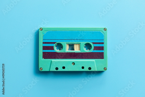 Vintage audio cassette on blue background