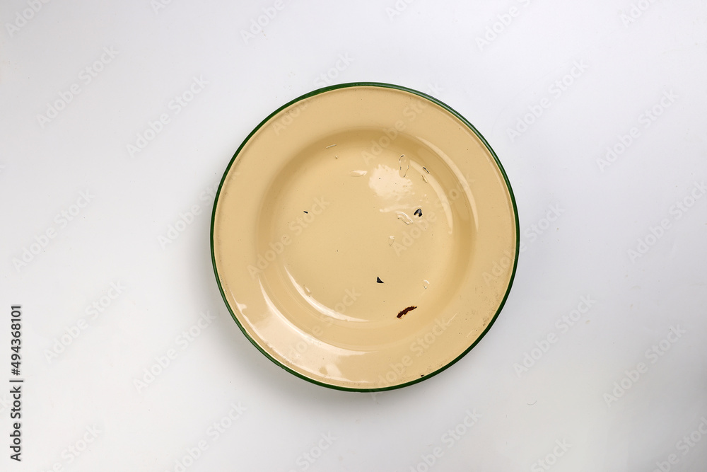 Enamel tin metal food plate pot bowl retro vintage tableware dinnerware on white background top view Enamel tin metal food plate pot bowl retro vintage tableware dinnerware on white background top view