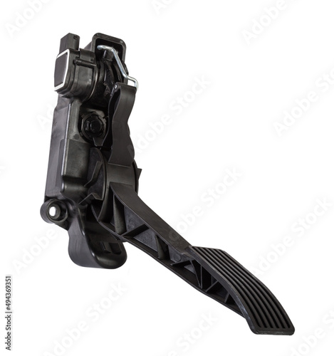 Floor gas pedal on a white isolated background in a photo studio for sale in a car service. Black auto part for replacement during repair in the workshop. Spare part junkyard