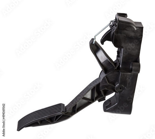 Floor gas pedal on a white isolated background in a photo studio for sale in a car service. Black auto part for replacement during repair in the workshop. Spare part junkyard