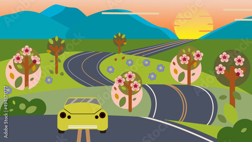 Bright green car on a winding road that leads to horizon. Spring family road trip concept