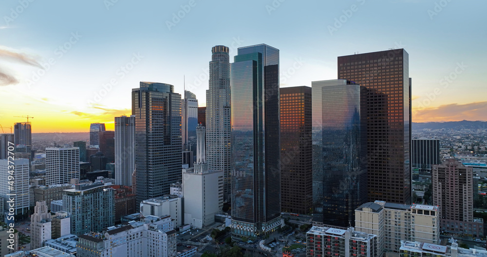 Fototapeta premium Sunset over Los Angeles downtown. Los Angels downtown skyline, panoramic city skyscrapers.