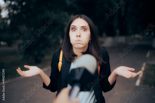 фотографія Clueless Woman Being Interviewed on The Street by Tv Reporter