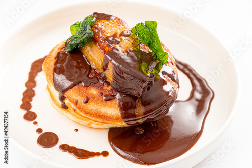pancakes with chocolate sauce and mint