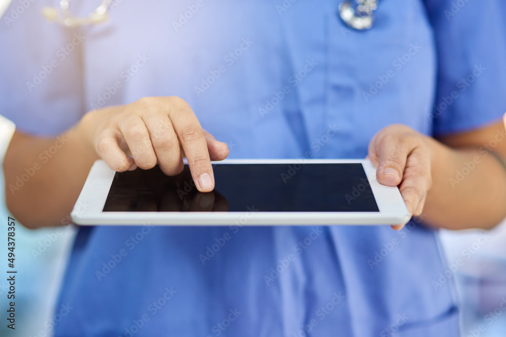 For quick and easy access to all patient records. Closeup shot of a medical practitioner using a digital tablet.