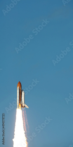 Fototapeta Naklejka Na Ścianę i Meble -  Space Shuttle takes off into space. Elements of this image furnished by NASA.