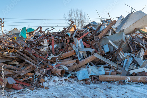 Panoramic view of a pile of rusty scrap metal at a landfill for recycling. Recycling and recycling of metal.
