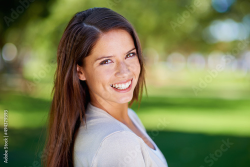 Im all smiles today. Portrait of a beautiful young woman enjoying a day at the park.