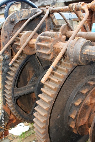 brown rusty heavy gears of an old gearbox in closeup