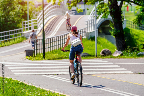 Wallpaper Mural Cyclist ride on the bike path in the city Park
 Torontodigital.ca