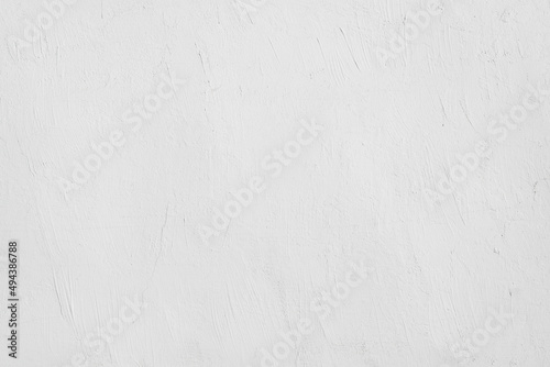 Uneven textural surface of gray wall with scuffs. Empty textured background