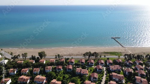 Сamera shoots from above the landscape of sea.Beautiful villas on the shores of the Turkish Sea	
