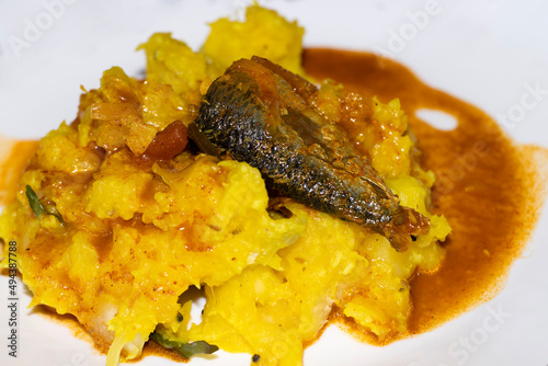 Kerala Style Yellow Tapioca With Fish Curry photo