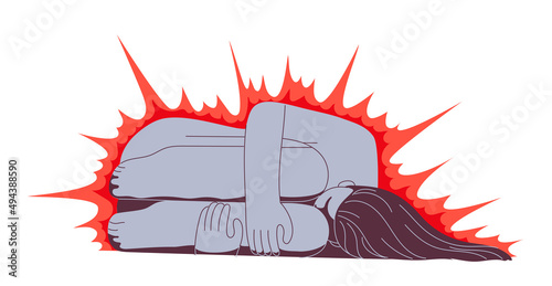 Woman in misery lies clenched and hugging her knees.