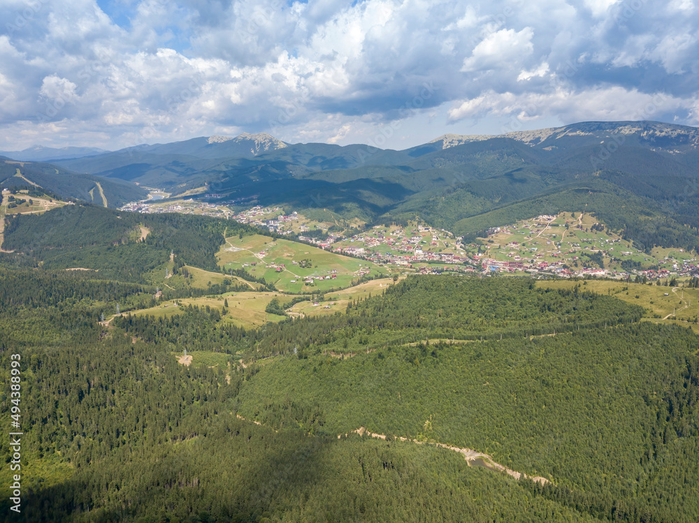 Fototapeta premium Green mountains of Ukrainian Carpathians in summer. Sunny day. Aerial drone view.