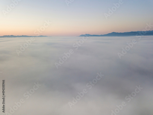 Morning fog in the Ukrainian Carpathians. Aerial drone view.