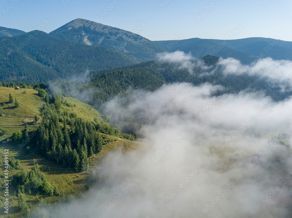 Morning fog in the Ukrainian Carpathians. Aerial drone view. Morning fog in the Ukrainian Carpathians. Aerial drone view.