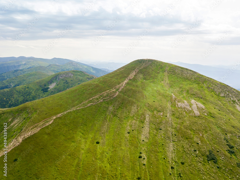High mountains of the Ukrainian Carpathians in cloudy weather. Aerial drone view. High mountains of the Ukrainian Carpathians in cloudy weather. Aerial drone view.