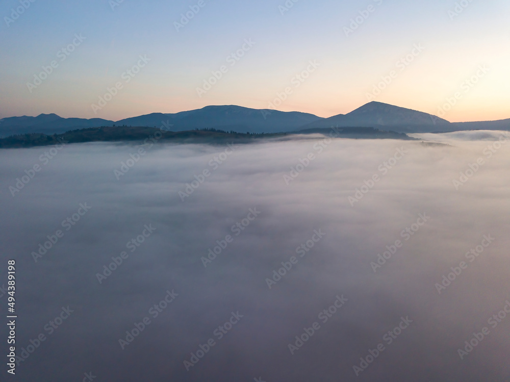 Morning fog in the Ukrainian Carpathians. Aerial drone view. Morning fog in the Ukrainian Carpathians. Aerial drone view.