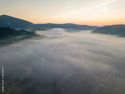 Morning fog in the Ukrainian Carpathians. Aerial drone view.