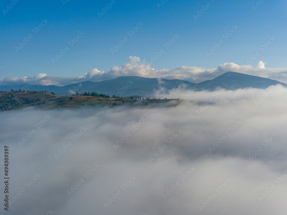 High flight above the clouds in the mountains. Aerial drone view. High flight above the clouds in the mountains. Aerial drone view.