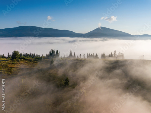 Foggy summer morning in the Ukrainian Carpathians. Aerial drone view.