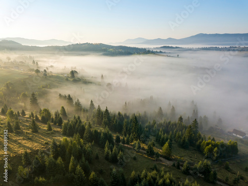 Morning mist in Ukrainian Carpathian mountains. Aerial drone view.