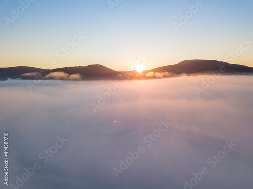 Sunrise over the fog in the Ukrainian Carpathians. Aerial drone view. © Sergey