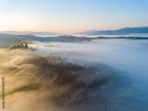 Morning fog in the Ukrainian Carpathians. Aerial drone view.