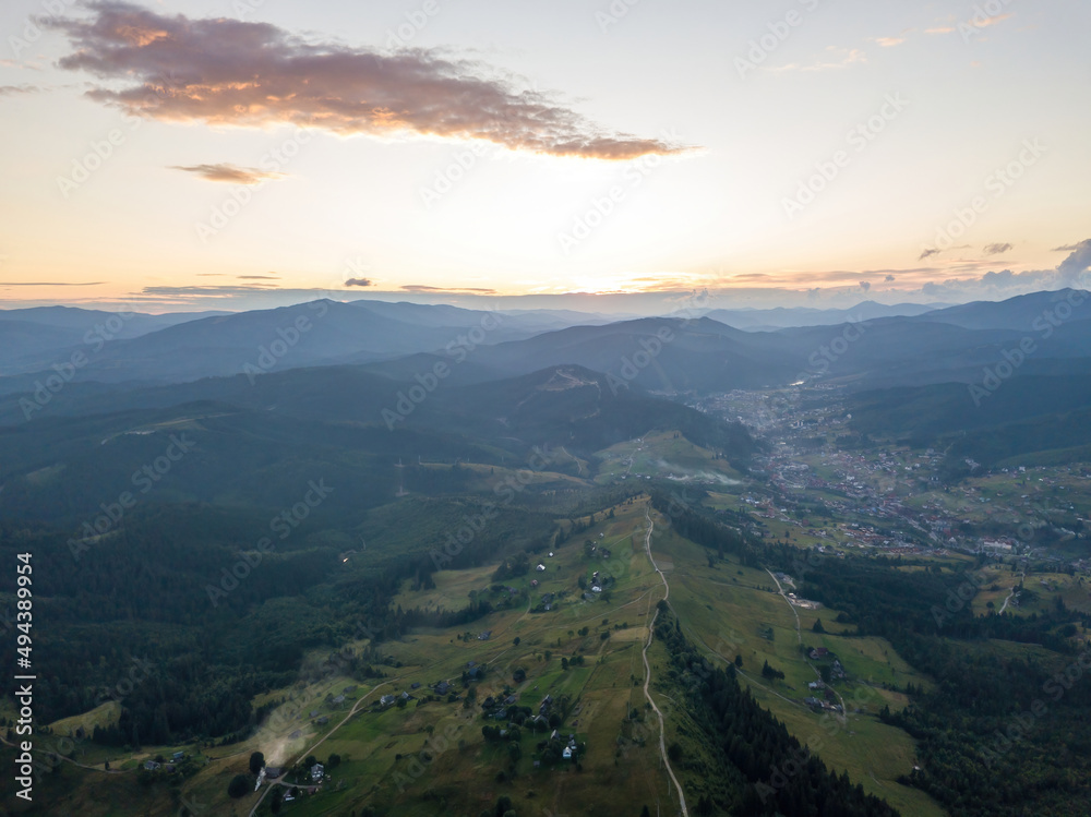 Sunset over the mountains in the Ukrainian Carpathians. Aerial drone view.